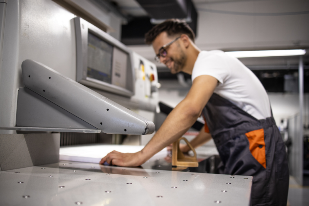 the best envelope printer in brisbane - image of man using printing machine