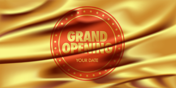 Gold material banner with "Grand Opening" written in red circle surrounded by gold stars - Brisbane Banner Printing - Call Infinite Print today