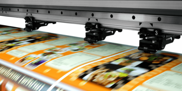 Orange and white posters being printed at high speed - Brisbane's best Poster Printing - Call Infinite Print today